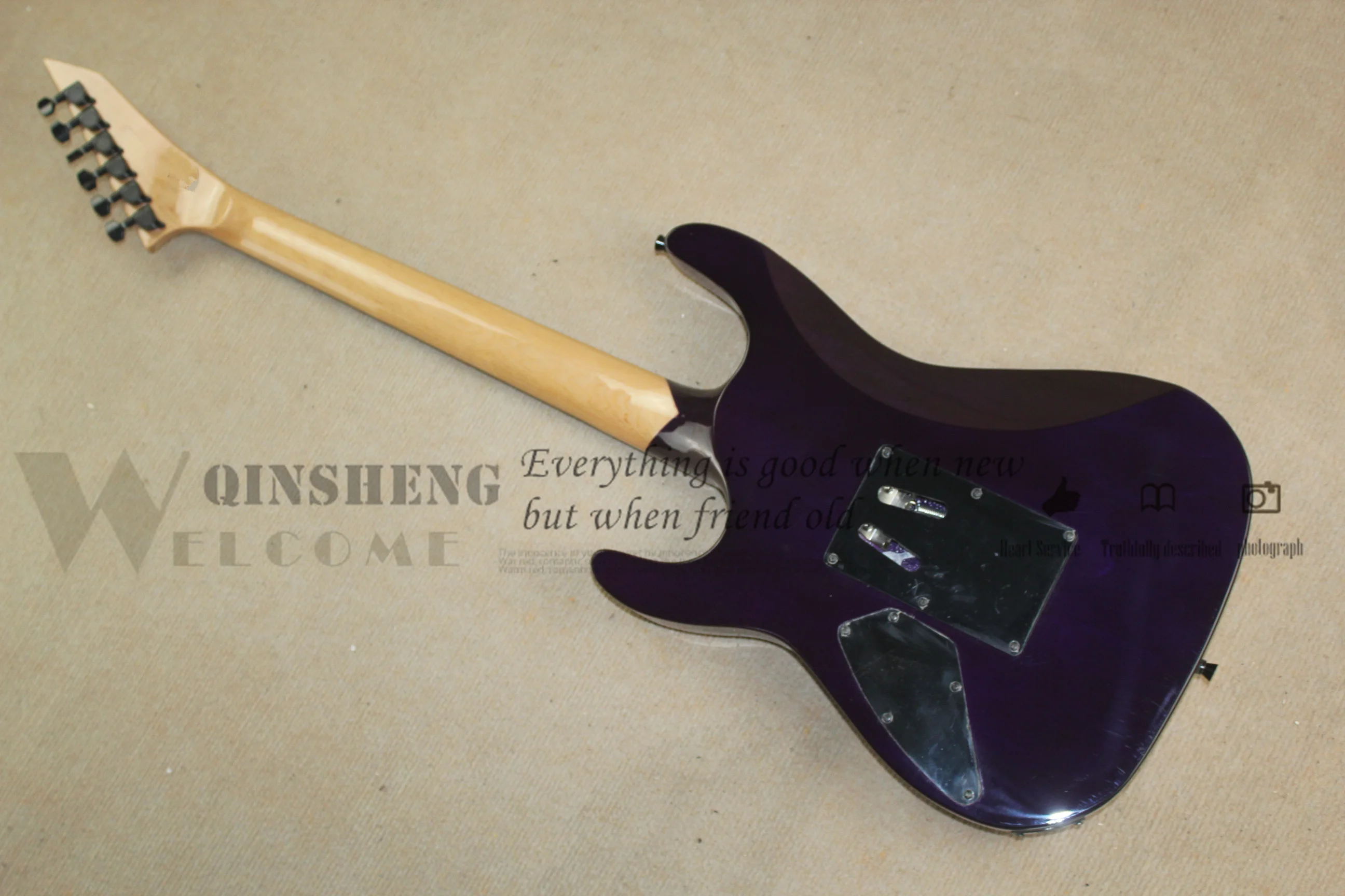 Classic electric guitar, purple guitar flamed maple veneer, vibrato bridge, rosewood fingerboard skull inlay, black button