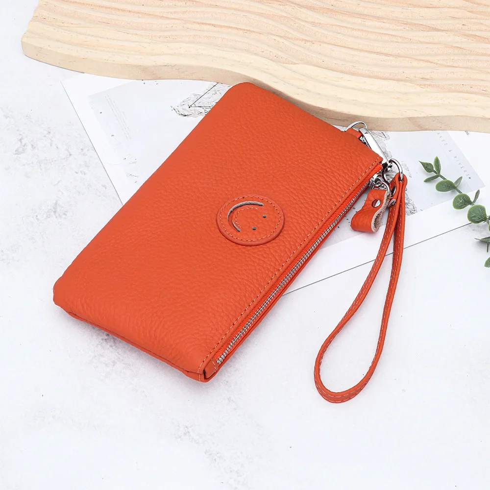 2025年新作 レディースクラッチバッグ 本革 牛革 コインケース カードホルダー ファッションデザイナー 笑顔の顔付き スマホ財布 パーティーバッグ