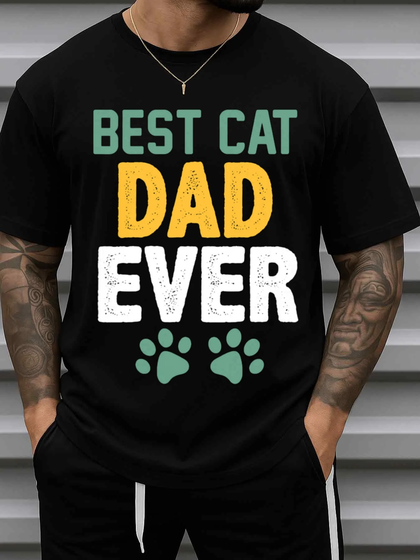Men's Best Cat Dad Graphic T-Shirt - Casual Crew Neck Short Sleeve with Fun Cat Paw and Cat Face Print - All-Season Style for Cat Lovers - Ideal Gift for Dad, Husband, Cat Owner - Black Background with Yellow Lettering - Fun Pet Dad Gift