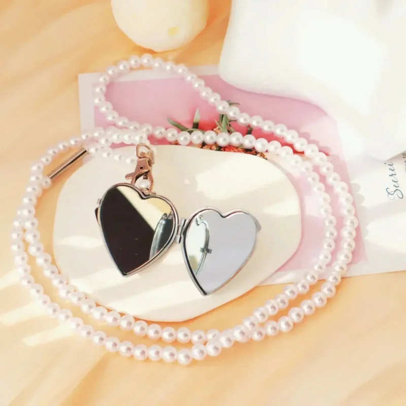 ¡Nueva y exquisita! Colgante de espejo en forma de corazón, cadena de cintura cruzada de perlas de imitación para mujer, joyería versátil