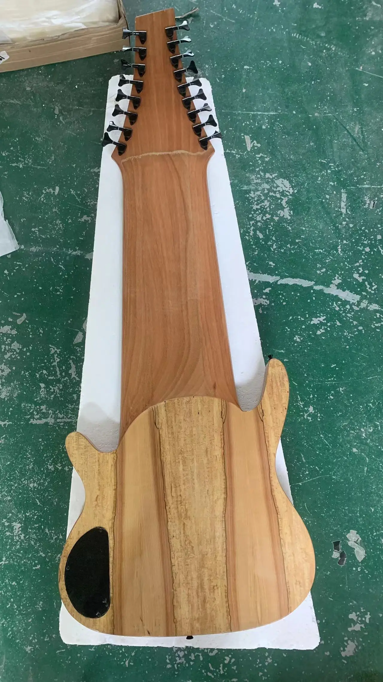 High quality 17 string bass electric guitar, landscape painting veneer, wood natural color, black hardware, fingerboard inlaid g