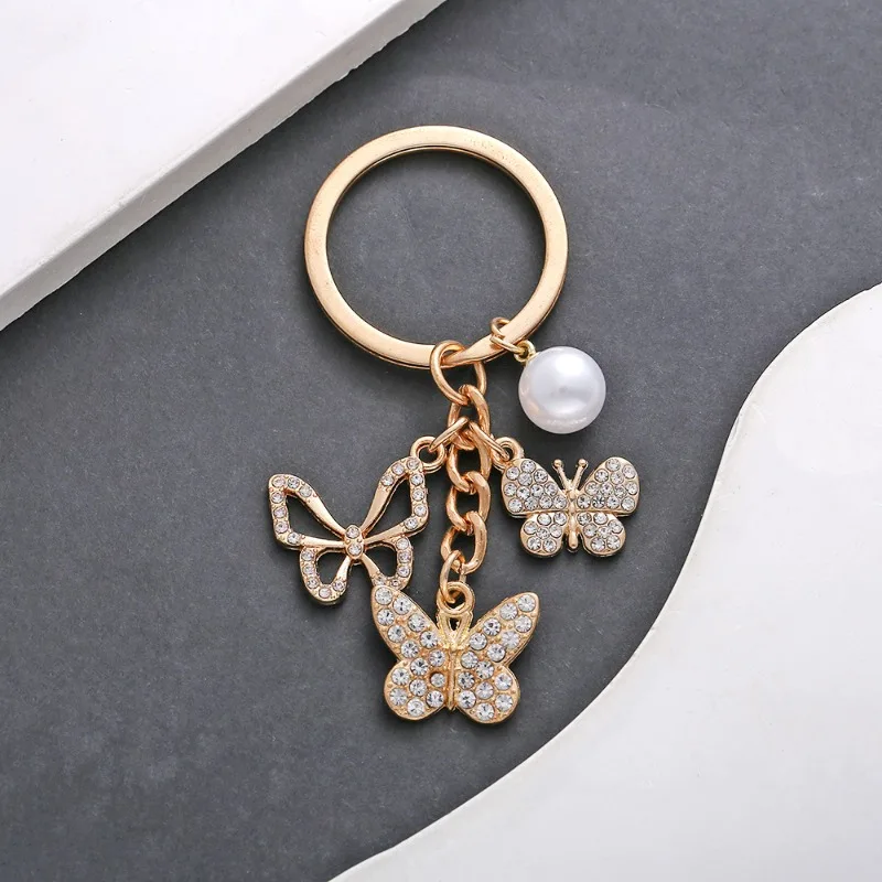 Модный брелок-бабочка с полым жемчугом, милая сумочка и подвеска для ключей от машины — модный аксессуар для багажного кошелька и автомобиля Модный брелок-бабочка с полым жемчугом, милая сумочка и подвеска для ключей от машины — модный аксессуар для багажного кошелька и автомобиля