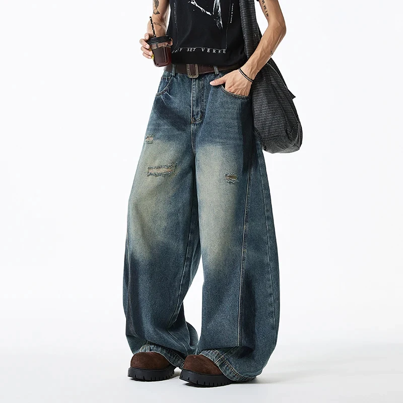 

2026 Весенние мешковатые мужские джинсы High Street с широкими штанинами и потертым дизайном в американском стиле High Street, потертые джинсовые брюки с изогнутыми ножами