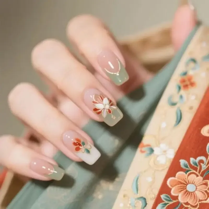

Handmade wearable nails, spring/summer Chinese‑style floral French gel nails—sophisticated, Instagram‑worthy, and flattering for