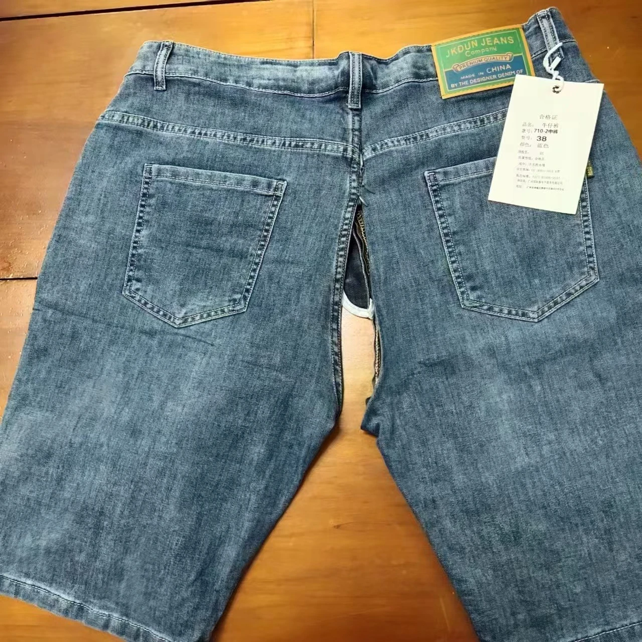 Pantaloncini di jeans da uomo Pantaloni aperti con cerniera invisibile Pantaloni estivi sottili di fascia alta elastici larghi con stampa dritta Pantaloni medi a cinque punti sottili