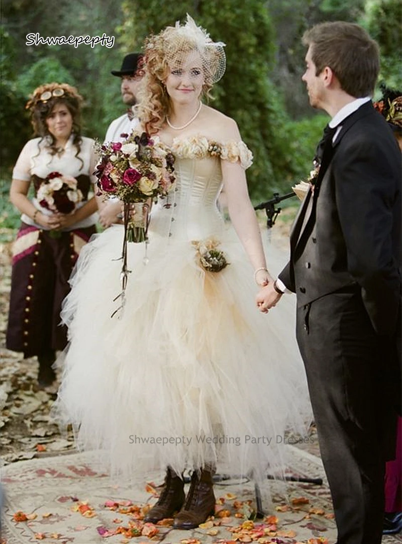 Robes de mariée victoriennes steampunk, tutu longueur rinçage, patients en tulle, quelles que soient les fleurs initiées, appliques ivoire et champagne