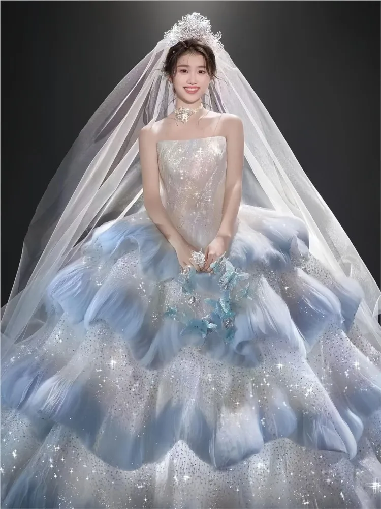 A new blue strapless theme photography haute couture dress with tail as the main fabric