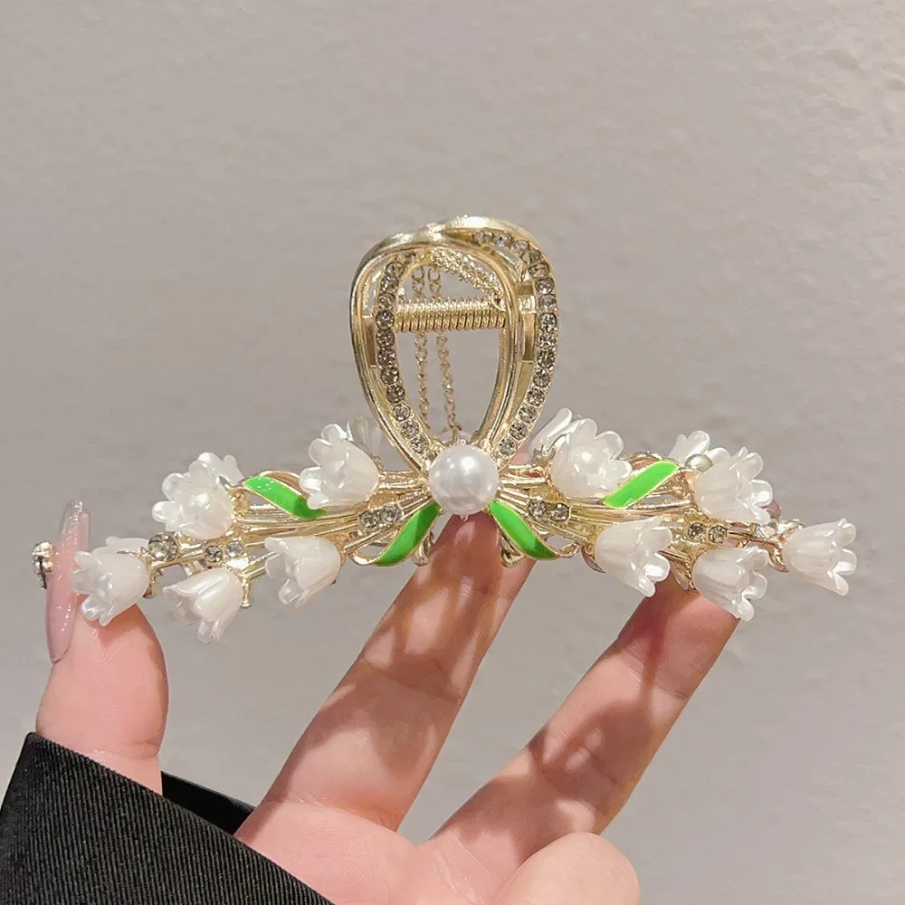 White Floral Hair Claw Gold Base Pearl Center Embellishments Delicate Bow Design Elegant Dreamy Events Graceful Detail Accessory