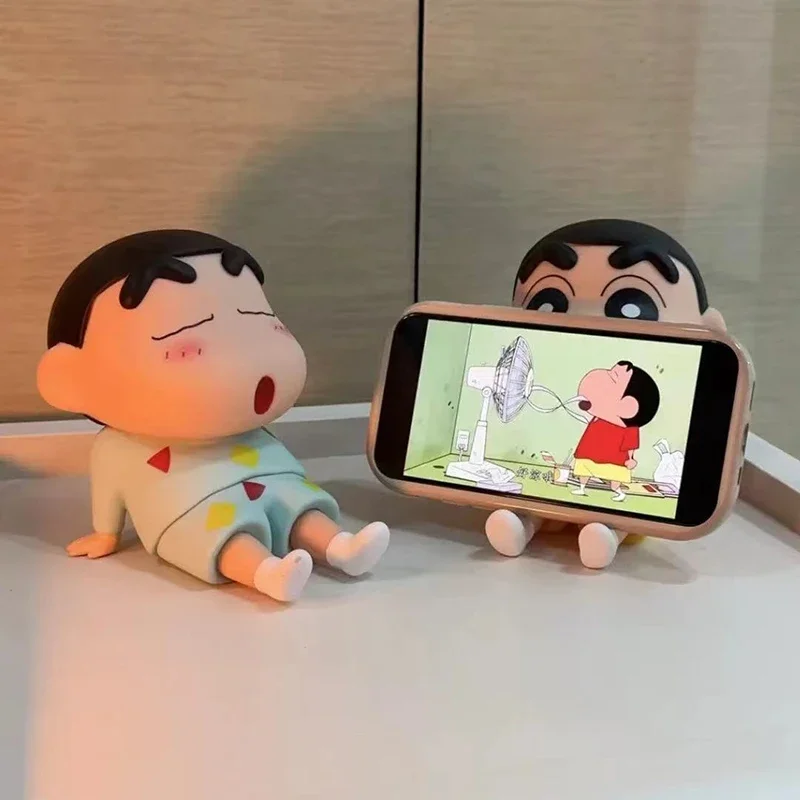 

Cartoon Crayon Shin-chan Mobile Phone Holder Kawaii Anime Desktop Decorations Cartoon Watch TV Phone Support Decorations Gifts F