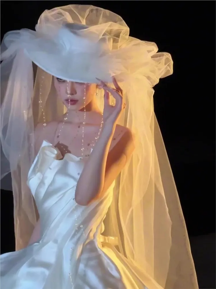 A new light strapless white dress with travel photography vibe and tail-end chiffon for going out