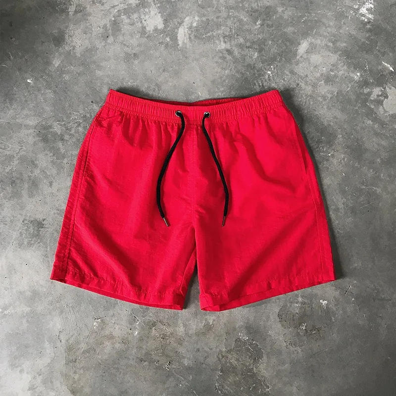 Ice Silk men\'s beach shorts Light breathable Summer sports shorts Candy color Surf Swimming loose sports shorts Extra large size