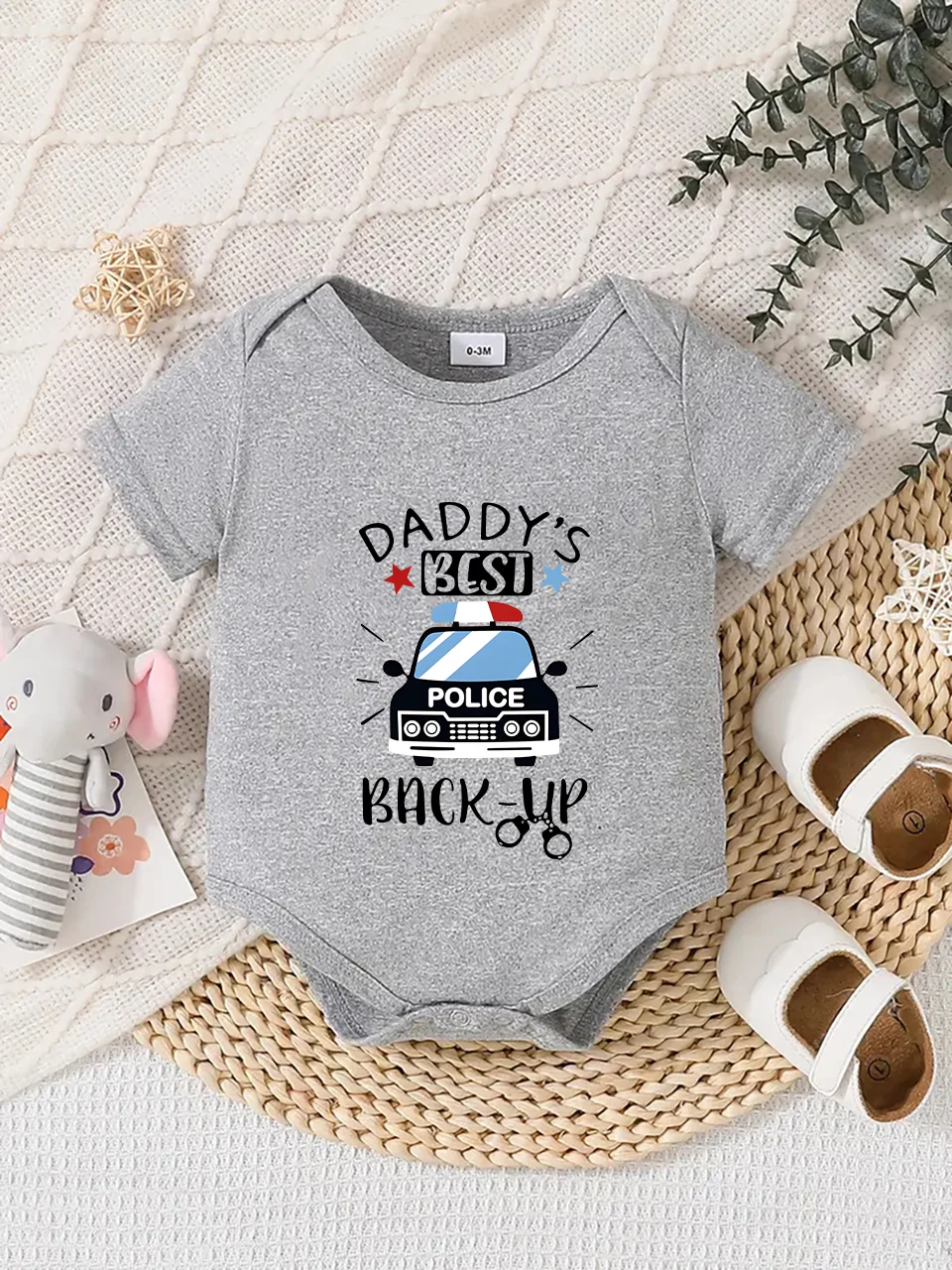 Playful letter-printed baby short-sleeve triangle bodysuit. Button closure for easy dressing, machine washable