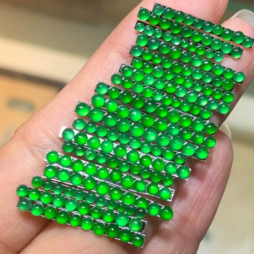 

Natural A jadeite full of green top bead ring surface, various inlays and manicures embellished with Guatemalan jadeite