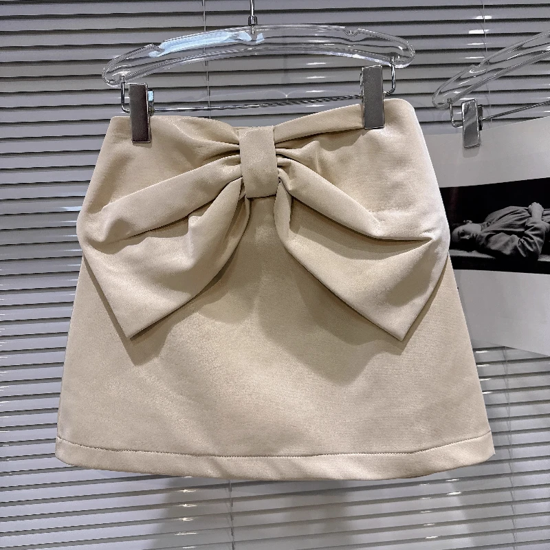 

2025 Autumn New French Style Socialite Three-Dimensional Bow Textured PU Leather Short Skirt, All-Match Solid Color Skirt Women