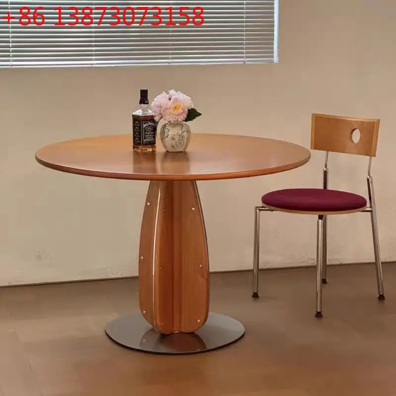 

Nordic solid wood dining table in the ancient style household small apartment French wabi wind negotiation table rock slab round