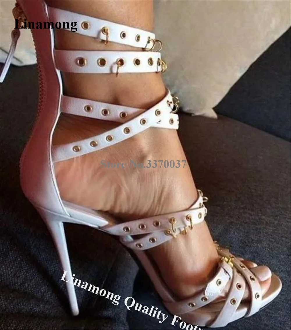 

Linamong Gold Rings Decorated Stiletto Heel Gladiator Sandals Unique Style White Black Straps Cross Thin Heel Shoes Party Heels