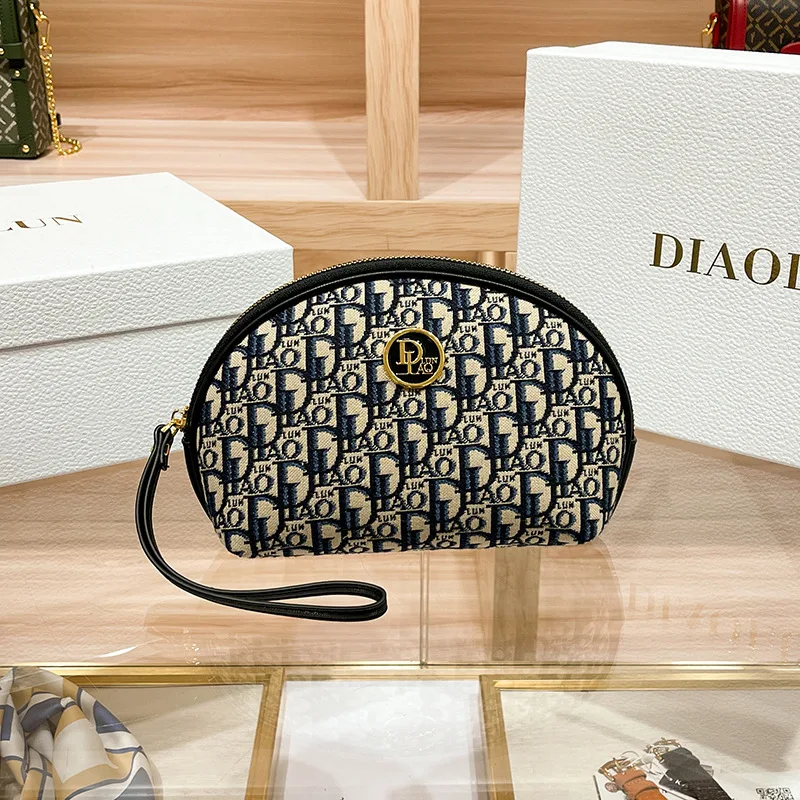 2023 Spring/summer new grip bag advanced sense embroidery printed makeup bag canvas texture hand purse M894