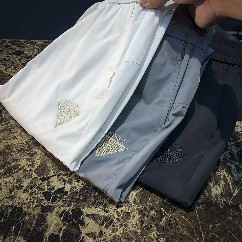 

Summer breathable sports casual pants men's thin stretch trendy brand embroidered fashionable quick drying pants