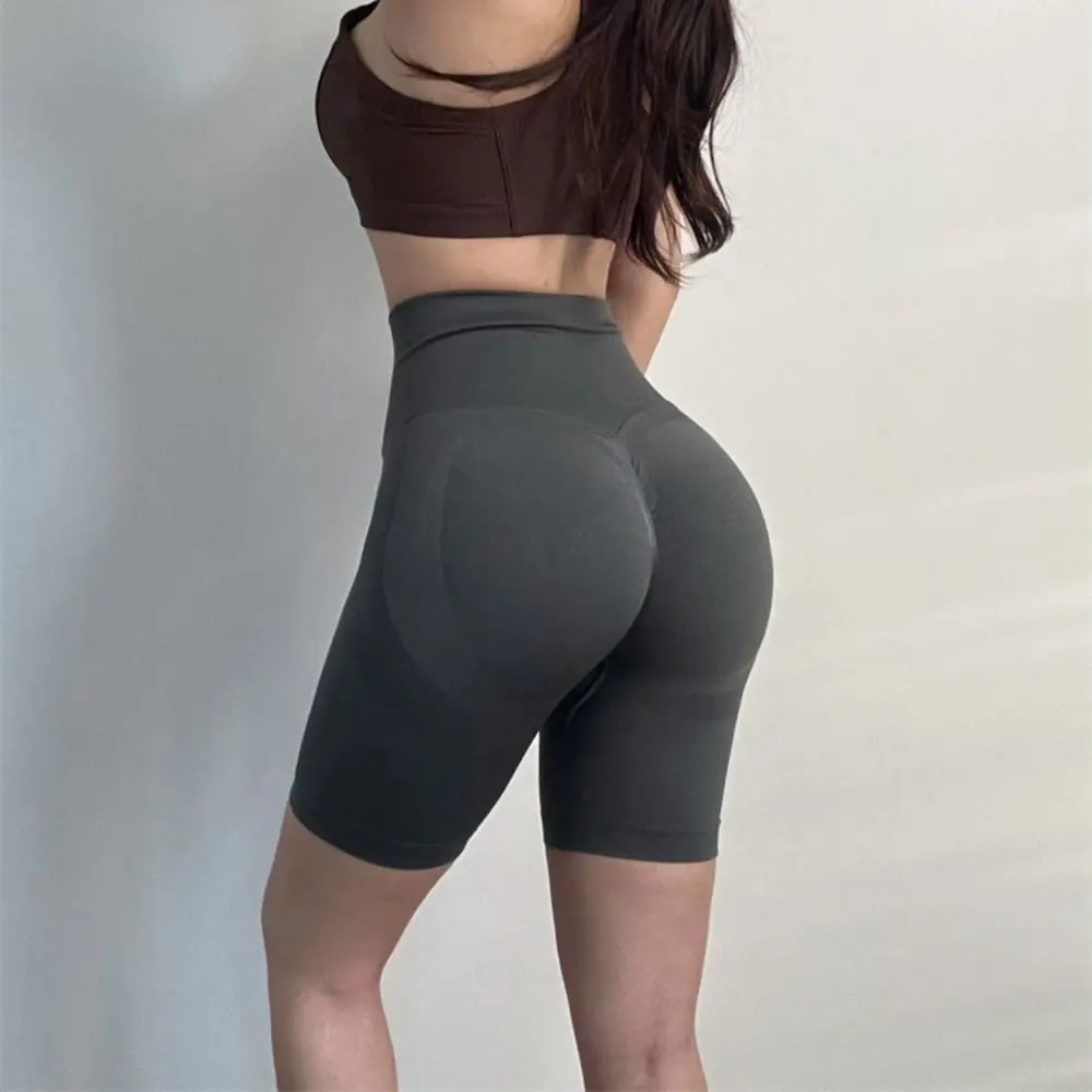 通気性のあるシームレスヨガパンツ、ヒップアップデザイン、高弾性フィットネスレギンス、ピーチヒップ、ミドル丈パンツ