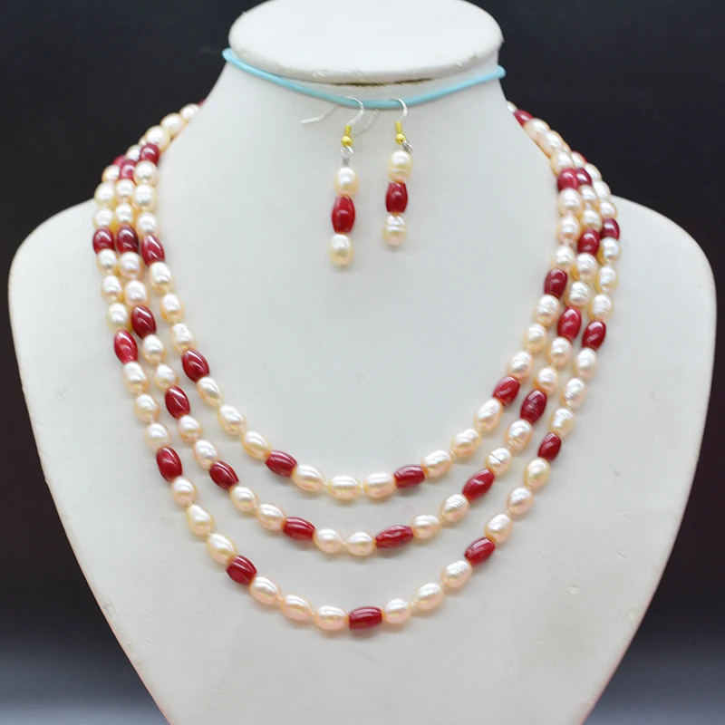 

3 layers, 7mm natural and coral pink pearl necklace. Earring set. The most popular jewelry for brides in Europe 18-23"