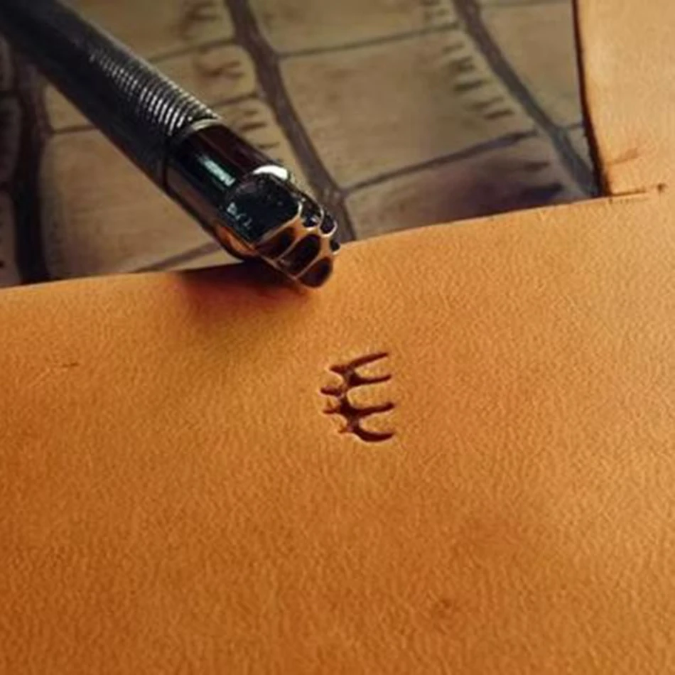 Leathercraft hardware tools, precision steel engraving and embossing tools, pine leaf pattern motifs. Custom orders accepted.