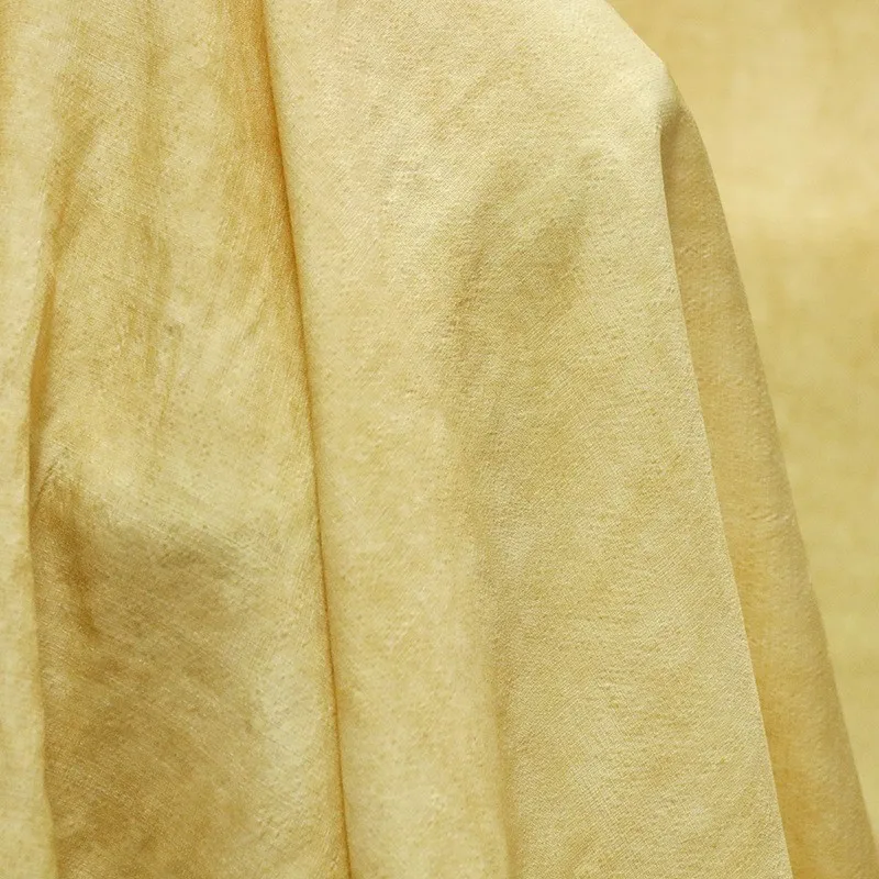 

This is a cold-dyed fabric made of dirty yellow natural tussah silk with textured stir-fried color for Hanfu fashion designers