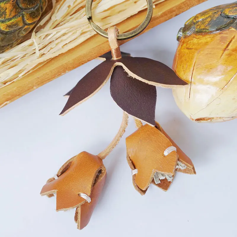 Handmade custom genuine leather design leather craft caramel brown floral leaf croissant keychain bag charm