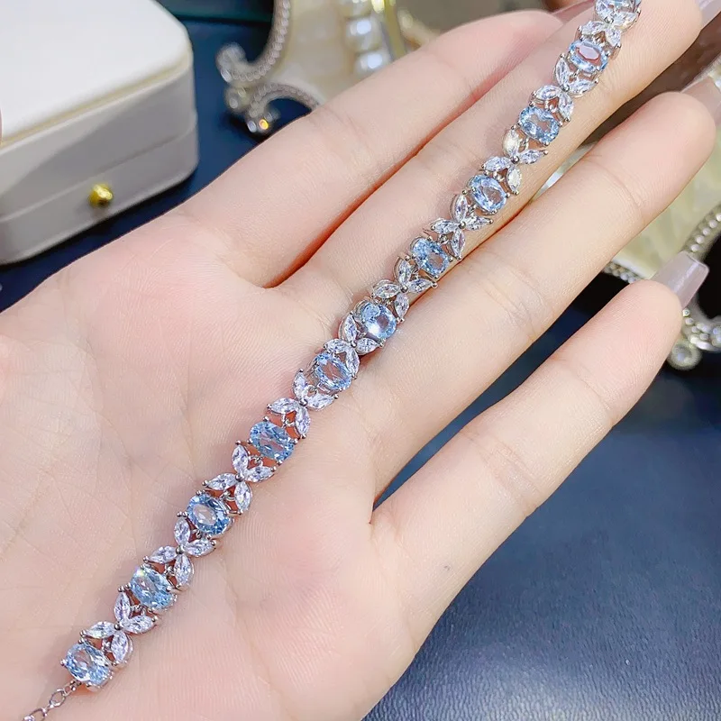 Natürliches Blaues Topas Tennis-Armband 4x6mm Ovaler Schliff S925 Silber mit CZ-Akzenten