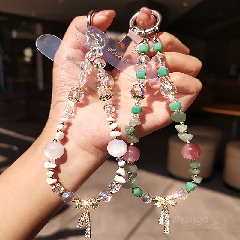

Mobile Phone Chain, Female Wrist Bow, Cat Eye Stone Pendant, High-end Outdoor Anti Loss Mobile Phone Lanyard, New Product