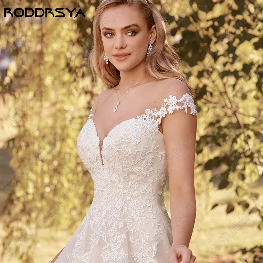 RODDRSYA Cap Mouwen A-lijn Trouwjurken voor Vrouw Boho Backless Applique Bride Gowns Tule ronde hals Vestids De NoviaRODDRSYA Cap Mouwen A-Lijn Bruidsjurken Voor Vrouw Boho Backless Applique Bruidsjurken Tule Scoop Nec