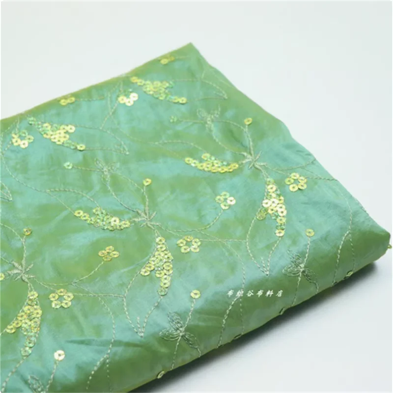 

Green full width embroidered nail bead three-dimensional chameleon fabric Chinese style top dress clothing fabric