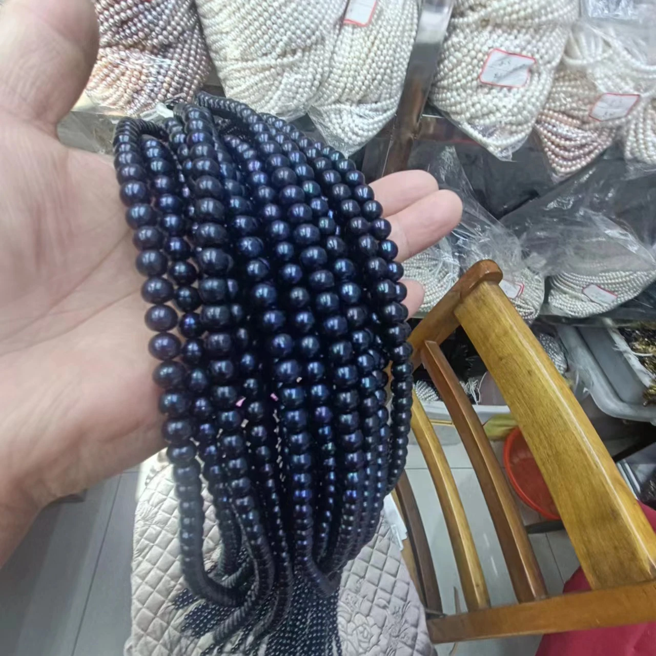 

16 inch ,8 mm black potato shape freshwater pearl ,some blue 100% freshwater loose pearl,high luster in strand