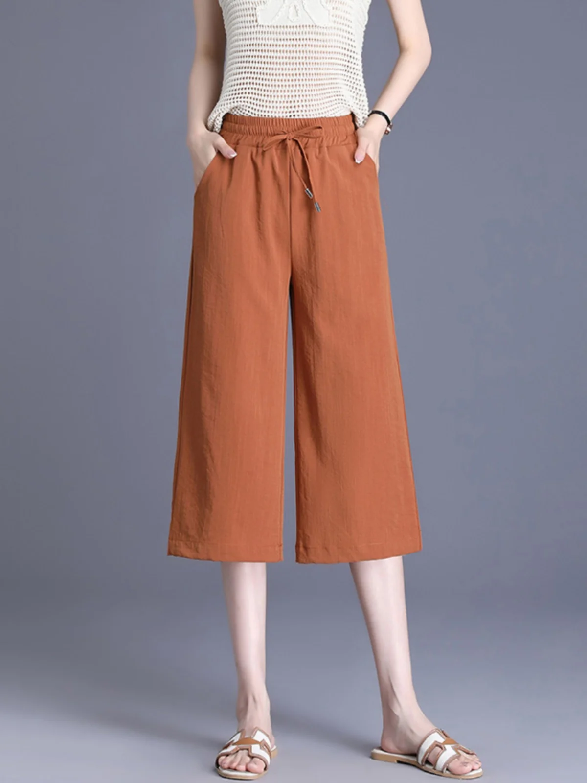 กางเกงขายาวทรงหลวมสำหรับฤดูร้อน ผู้หญิงไซส์ใหญ่ เอวสูง ความยาวเจ็ดส่วน สไตล์ลำลอง เหมาะสำหรับคุณแม่วัยกลางคน