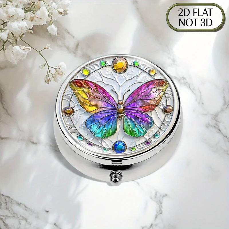 1-piece flat, portable, round metal pill box, featuring a rainbow butterfly design, brightly colored and inlaid with gemstones, used for storing medication in an organized manner, ideal for organizing vitamins, multi-functional storage for accessories and coins, thoughtfully designed in a flat form
