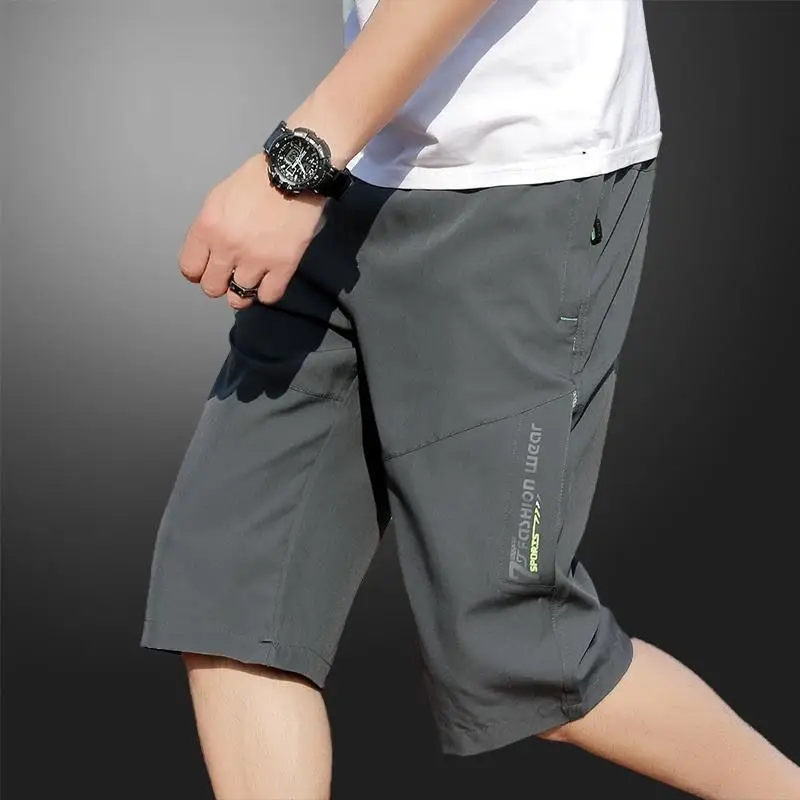 Shorts masculinos de trabalho, calças na altura do joelho, bolsos com zíper, shorts de verão, caminhadas, corrida, cintura elástica, shorts casuais