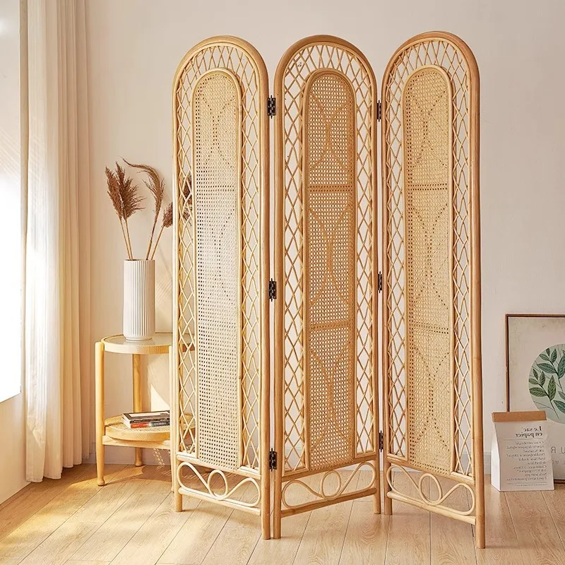 The living room enters the door to block the rattan screen