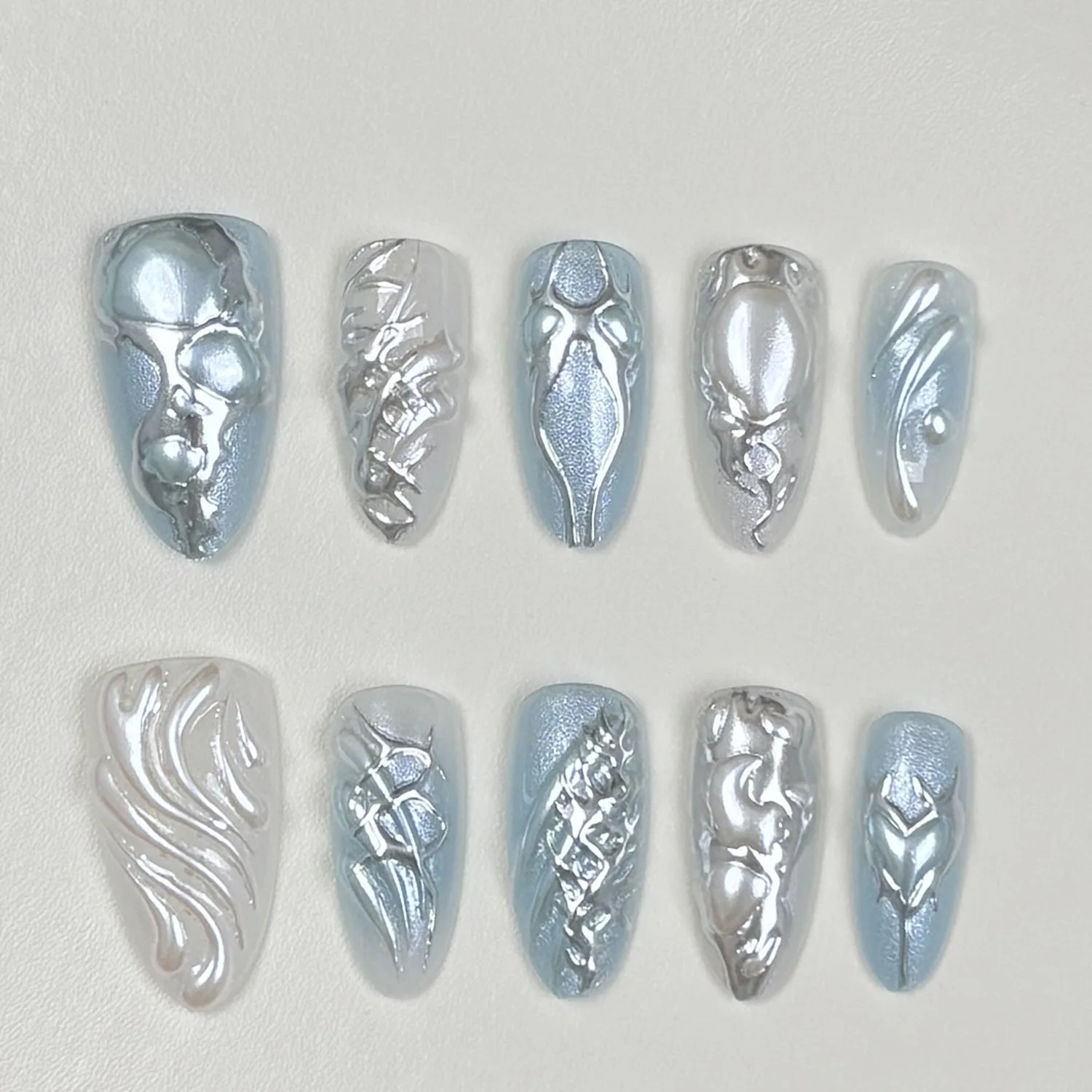 

24PCS Glitter Blue Blush Almond Fake Nails Metallic Silver Irregular Patterns French Press on Nails Cyberpunk Style Wearable Tip