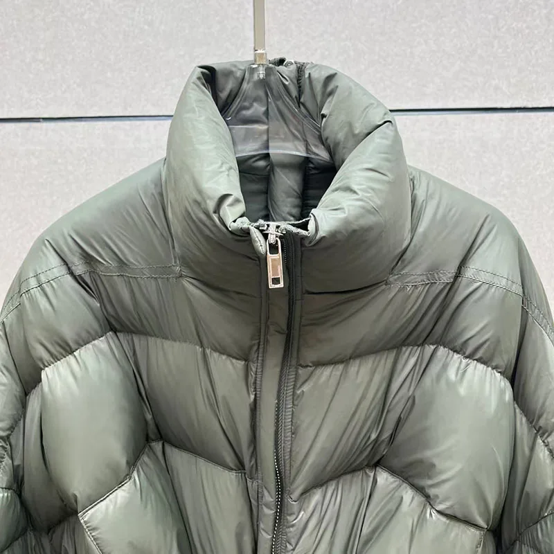 سترات نسائية شتوية جديدة 2025 برباط علوي فضفاض برقبة عالية سترة نسائية 90 بطة بيضاء مملوءة معطف سميك دافئ معاطف للأسفل