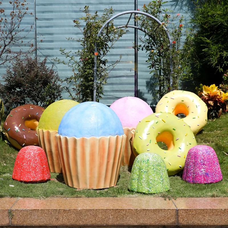 Real donut sculpture ornament, fiberglass cake model, at the entrance of the dessert shop in supermarket of the large shoppi