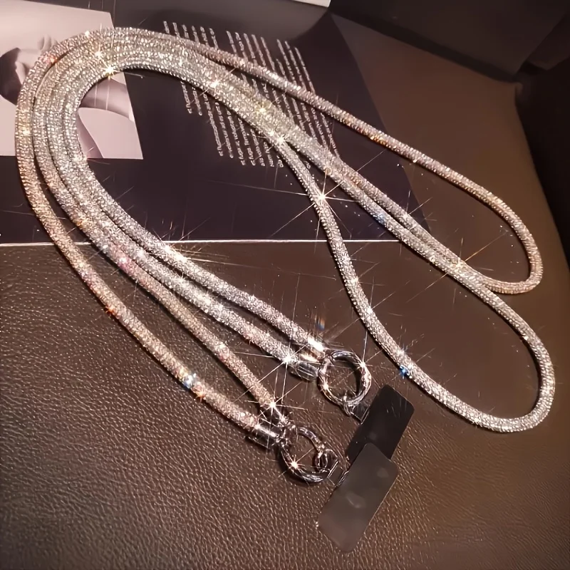 

1 шт. блестящий ремешок для телефона со стразами. Длинный ремешок через плечо с регулируемой пряжкой. Гламурный, удобный для использования смартфонов без помощи рук.