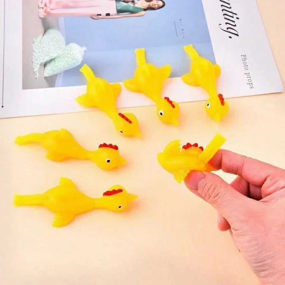 50-5pcs Novelty Catapulted Ejection Chicken Toy Light Rubber Finger Prank Flying Toy Slingshot Chicken Finger Toys Turkey Sticky