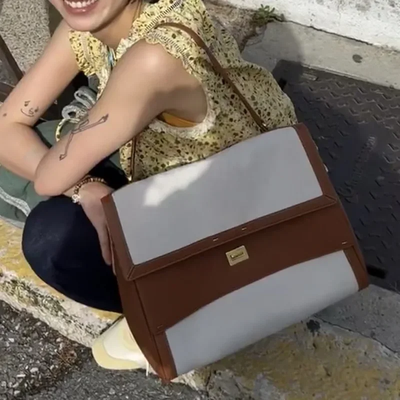 Mochila nueva cuero para ir al trabajo, bolso de mano un solo hombro para axila, bolso cubo versátil a la moda, empalme