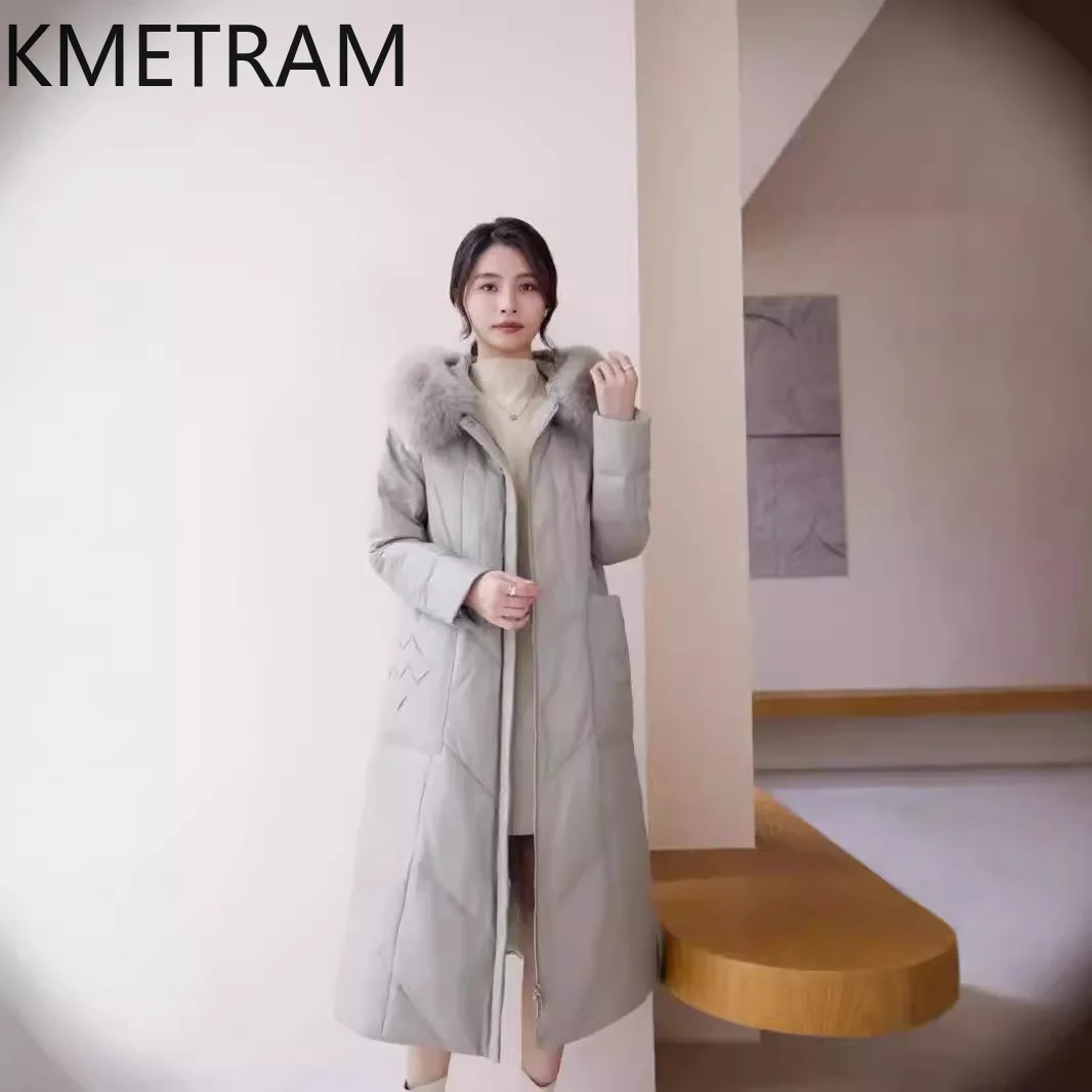 Piumino in pelle di pecora al 100% da donna Cappotti lunghi in vera pelle di alta qualità con cappuccio Collo in pelliccia di volpe 2025 Abiti invernali