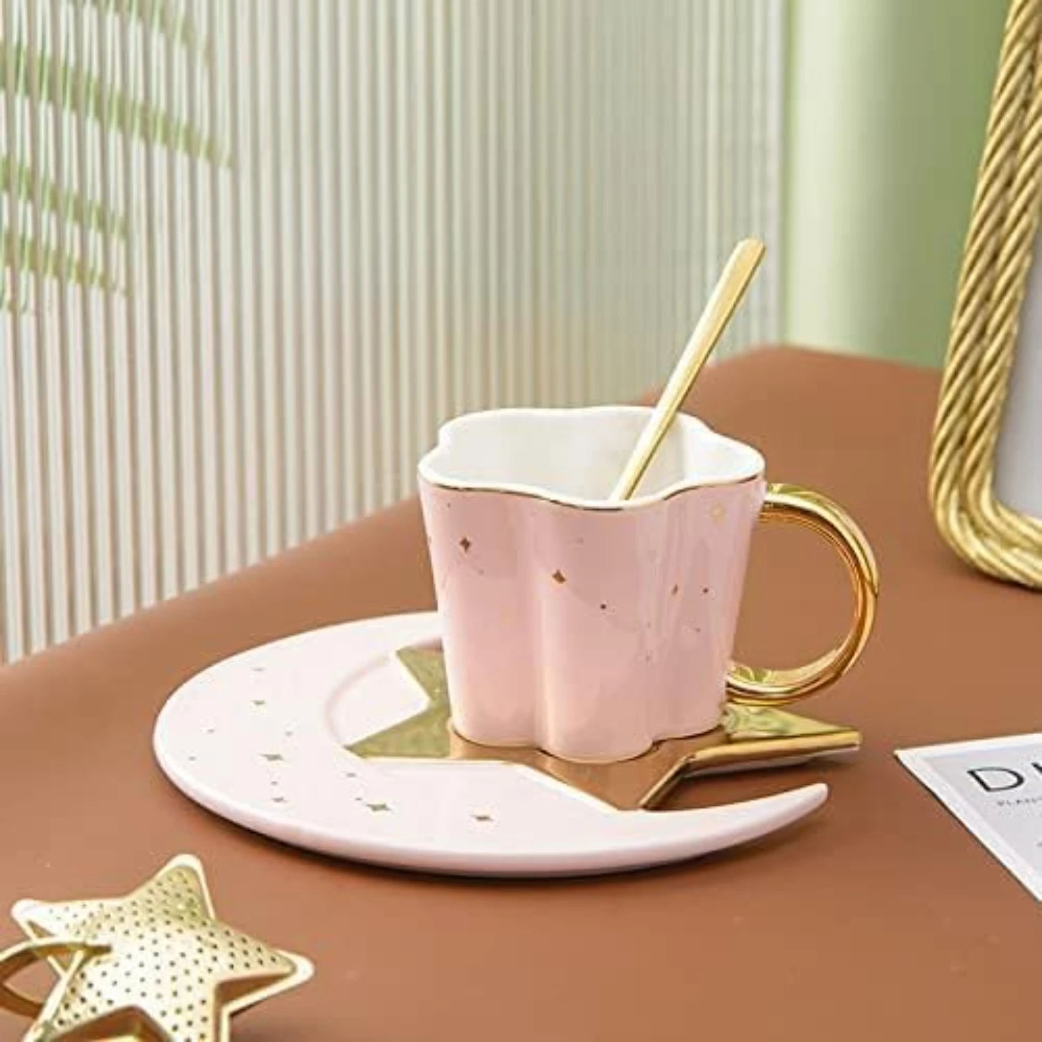 

Elegant and charming, this beautiful Golden Ceramic Coffee Cup and Saucer Set with Spoon is adorned with a lovely Star Moon desi