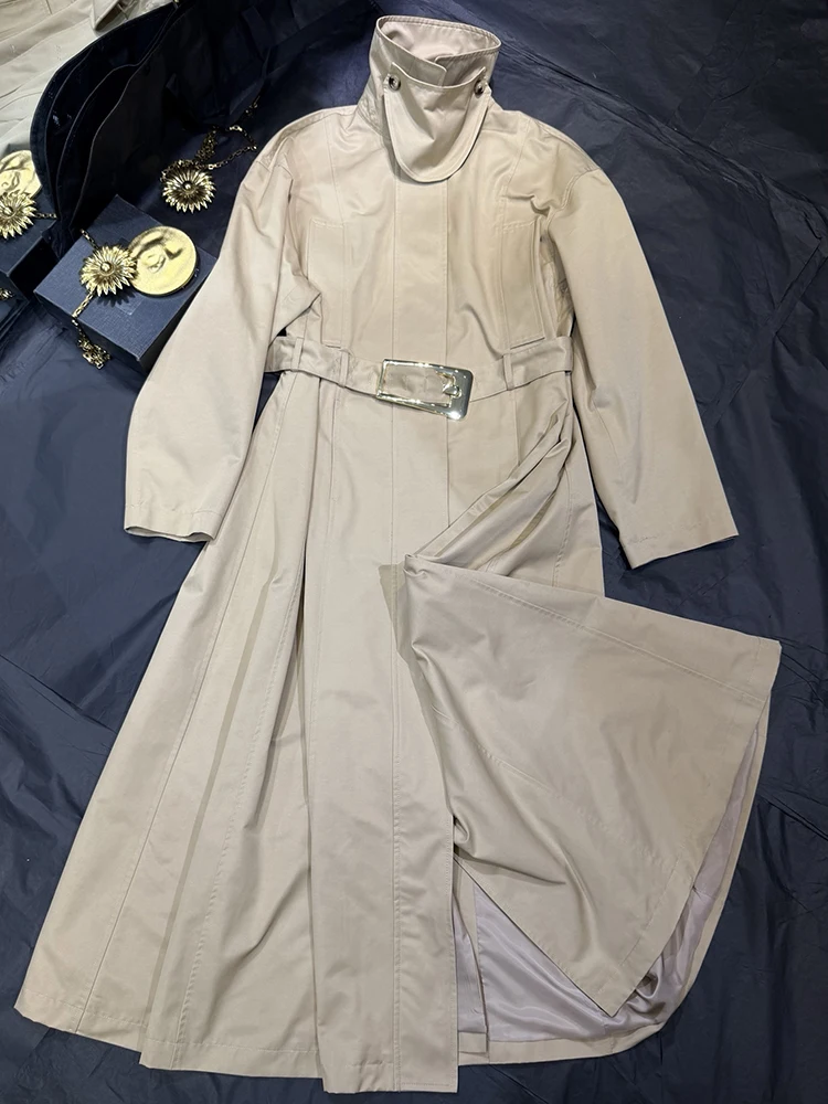 A generously belted turtleneck trench coat, a new autumn/winter 2026 style, featuring a loose, long silhouette for women.