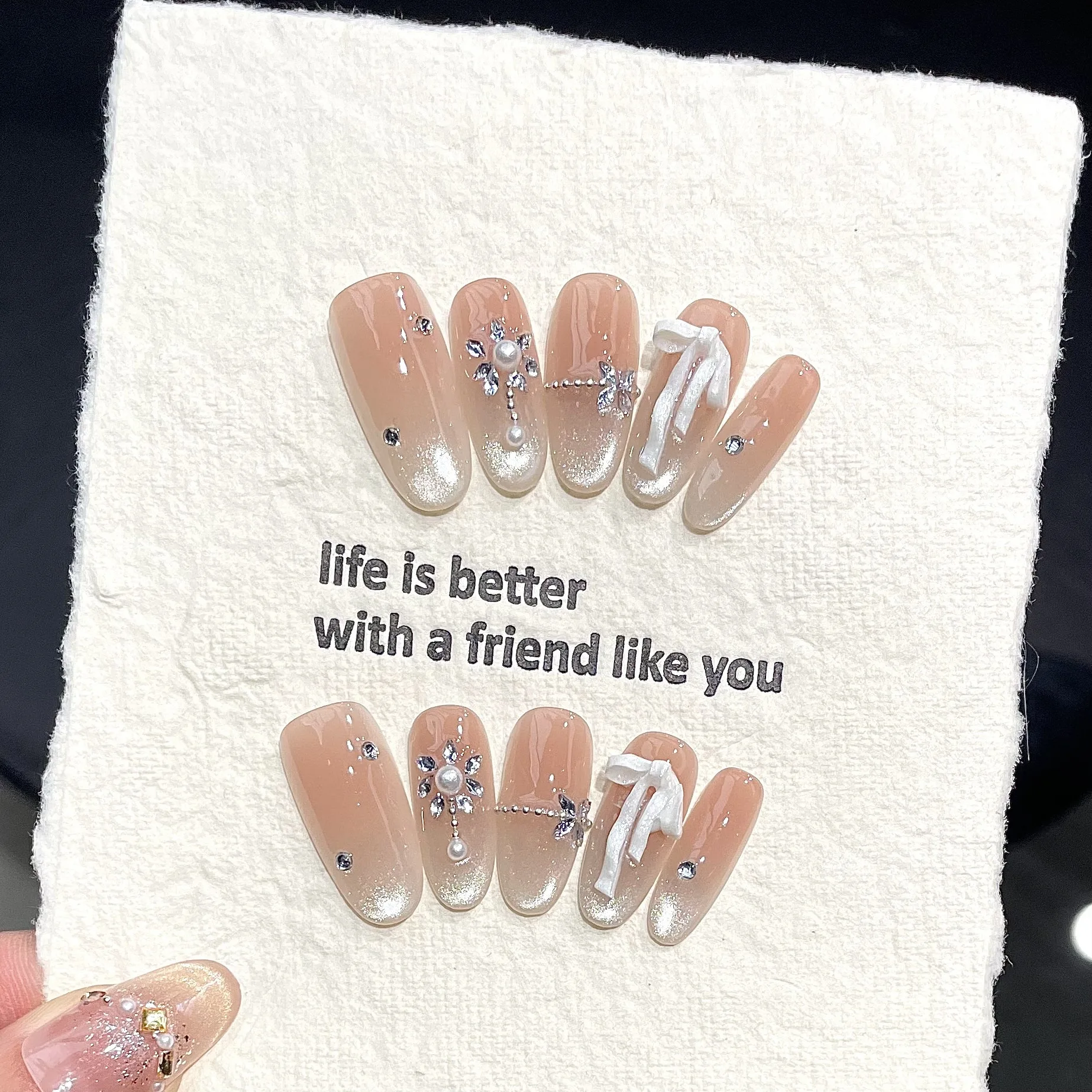 10 faux ongles ovales faits à la main, effet dégradé rose œil de chat, avec nœud blanc 3D, réutilisables et portables
