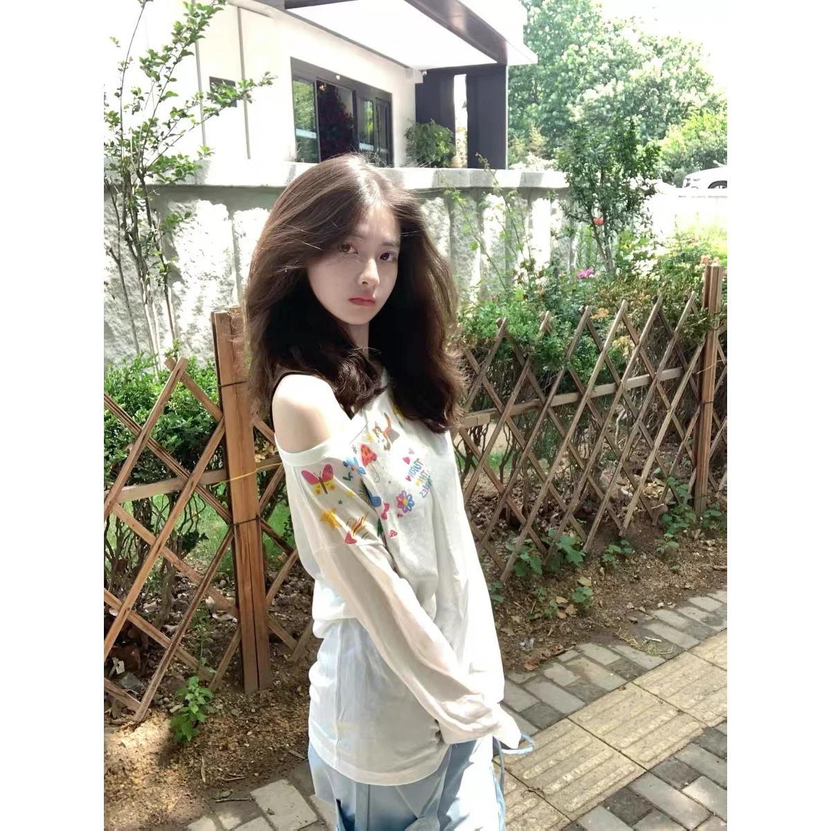 Loose Women's Long Sleeve T-Shirt Summer 2026 New Graffiti Painting Casual Design Sense Oversized Shoulder Design Top