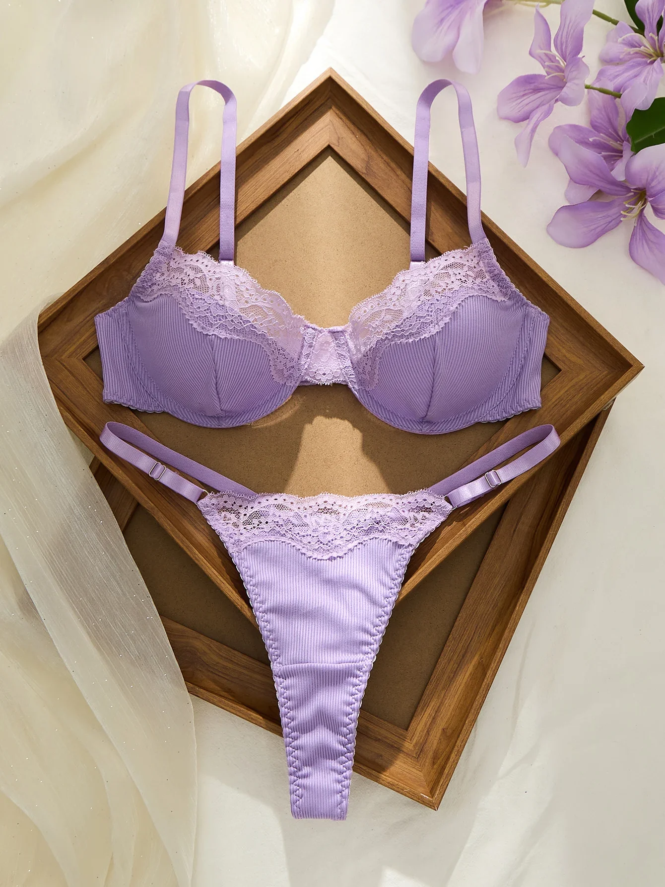 Underwire purple bra set with lace detail, adjustable straps, and matching G-string