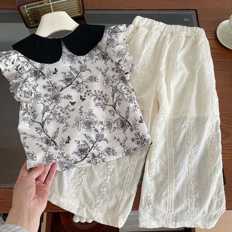 Mädchen anzug Sommer neue koreanische Version von Mädchen Revers Blumen ärmellose Top Hose zweiteilige Mädchen Mode Set