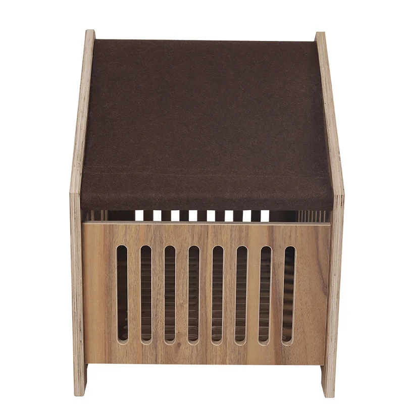 A large wood-grained furniture board cat house toy kennel in a wooden doghouse.